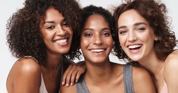 Portrait of young multiracial women standing together and smiling