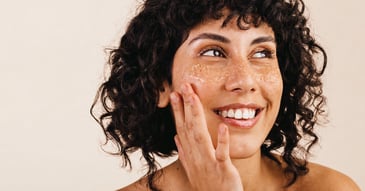 woman smiling exfoliating skin